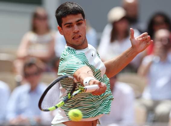 (230609) -- PARIS, June 9, 2023 -- Carlos Alcaraz of Spain hits a return during the men s singles semifinals between Novak Djokovic of Serbia and Carlos Alcaraz of Spain at the French Open tennis tournament at Roland Garros in Paris, France, June 9, 2023. ) (SP)FRANCE-PARIS-TENNIS-ROLAND GARROS-FRENCH OPEN-MEN S SINGLES GaoxJing 