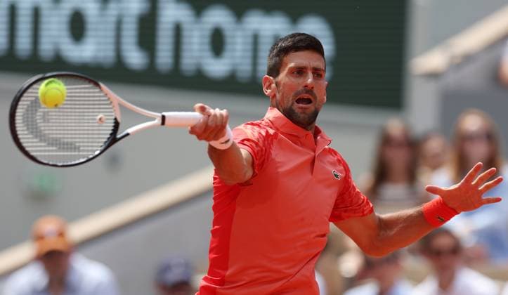 (230609) -- PARIS, June 9, 2023 -- Novak Djokovic of Serbia hits a return during the men s singles semifinals between Novak Djokovic of Serbia and Carlos Alcaraz of Spain at the French Open tennis tournament at Roland Garros in Paris, France, June 9, 2023. ) (SP)FRANCE-PARIS-TENNIS-ROLAND GARROS-FRENCH OPEN-MEN S SINGLES GaoxJing 
