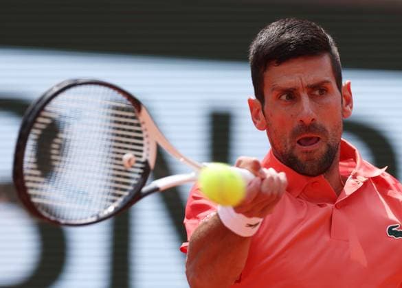 (230609) -- PARIS, June 9, 2023 -- Novak Djokovic of Serbia hits a return during the men s singles semifinals between Novak Djokovic of Serbia and Carlos Alcaraz of Spain at the French Open tennis tournament at Roland Garros in Paris, France, June 9, 2023. ) (SP)FRANCE-PARIS-TENNIS-ROLAND GARROS-FRENCH OPEN-MEN S SINGLES GaoxJing 
