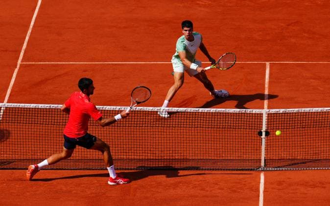 Mandatory Credit: Photo by Javier Garcia Shutterstock (13949278ah) Novak Djokovic and Carlos Alcaraz battle at the net French Open Tennis, Day 13, Roland Garros, Paris, France - 09 June 2023 French Open Tennis, Day 13, Roland Garros, Paris, France - 09 June 2023  Copyright: xJavierxGarcia Shutterstockx 13949278ah