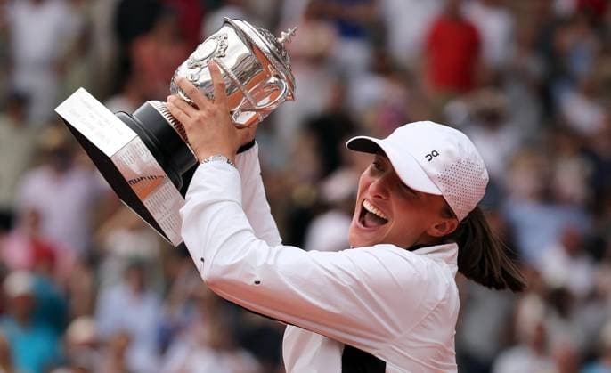 Top-seeded Iga Swiatek of Poland hold her trophy after winning her finals match against Karolina Muchova of the Czech Republic at the French Tennis Open in Paris, France, on Saturday, June 10, 2023. Swiatek won the open 6-2, 5-7, 6-4.  PAR20230610137 MAYAxVIDON-WHITE