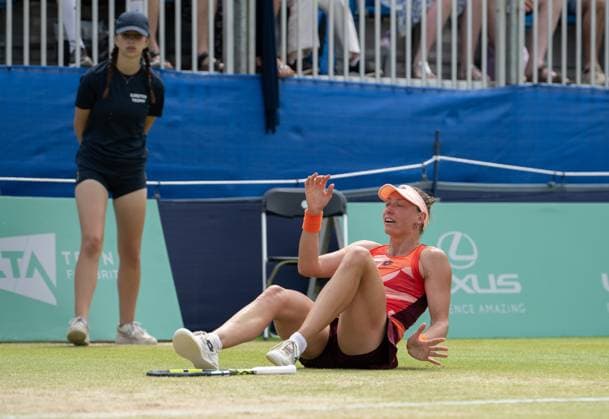 Yanina Wickmayer (BEL) collapses falls to the ground in celebration after winning the final in the third set tie break in her match with Katie Swan (GBR) in the final of the W100 Surbiton Trophy on the Final day of the Surbiton Trophy, at Surbiton Lawn Tennis Club, Surbiton, England on the 11th June 2023. Copyright: xAlanxStanfordx PMI-5588-0129