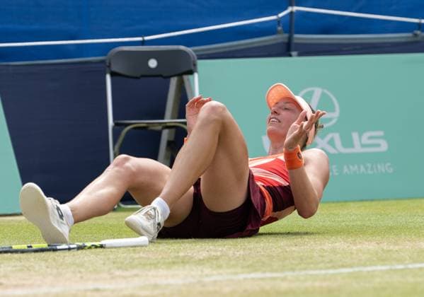 Yanina Wickmayer (BEL) collapses falls to the ground in celebration after winning the final in the third set tie break in her match with Katie Swan (GBR) in the final of the W100 Surbiton Trophy on the Final day of the Surbiton Trophy, at Surbiton Lawn Tennis Club, Surbiton, England on the 11th June 2023. Copyright: xAlanxStanfordx PMI-5588-0125