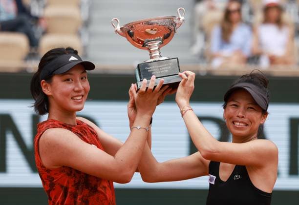 (230611) -- PARIS, June 11, 2023 -- Wang Xinyu (L) of China Hsieh Su-Wei of Chinese Taipei hold together the Simonne Mathieu Cup after winning the women s doubles final against Leylah Fernandez of Canada Taylor Townsend of the United States at the French Open tennis tournament at Roland Garros in Paris, France, June 11, 2023. ) (SP)FRANCE-PARIS-TENNIS-ROLAND GARROS-FRENCH OPEN-WOMEN S DOUBLES GaoxJing 