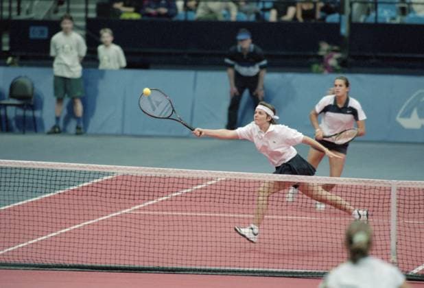 Moscow, Russia. Players of the French Tennis Team Nathalie Tauziat (front) and Amelie Mauresmo (back) compete against players of the Russain Tennis Team Yelena Likhovtseva and Tatyana Panova in the 1 4 World Group match of the Tennis Federation Cup between teams of Russia and France. The Russian team won with the total score of 2:1. Roman Denisov TASS  18865496