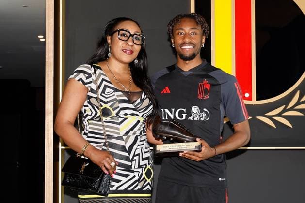TUBEKE, BELGIUM - JUNE 13: Tresor Mike posing with his mother and The Ebony Shoe, a football trophy that is awarded annually in Belgium by the non-profit organization African Culture Promotion and Friendly Foot to the best player from Africa or of African descent in the Jupiler Pro League pictured after a training session of the Belgian National Football Team prior to the Euro 2024 qualification matches against Austria and Estonia at the RBFA Headquarters on June 13, 2023 in Tubeke, Belgium, 13 06 2023 ( media activities Belgian National Football Team 13 06 2023 PhotoNews Panoramic 