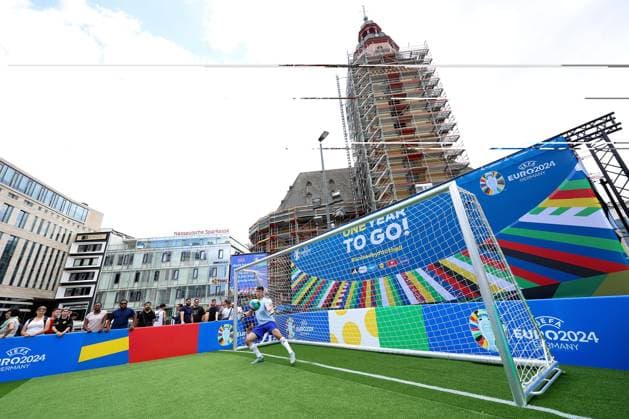 Frankfurt am Main, on 14 June 2923 press event UEFA EURO 2024 One Year To Go Hauptwache at St. Catherines Church in Frankfurt am Main v l , goal shooting in the Hauptwache, logo One Year To Go , in the background St. Catherines Church Copyright: JoaquimxFerreira
