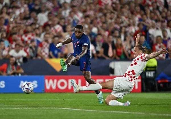 ROTTERDAM, NETHERLANDS - JUNE 14: Steven Bergwijn, Domagoj Vida in action during the UEFA Nations League 2022 23 semifinal match between Netherlands and Croatia at De Kuip on June 14, 2023 in Rotterdam, Nethe Netherlands v Croatia - UEFA Nations League 2022 23 Semifinal Copyright: xSebastianxFrejx
