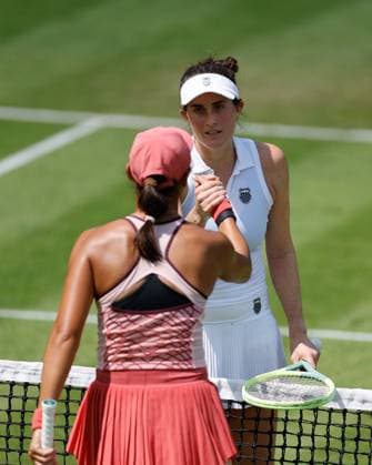21st June 2023; Edgbaston Priory Club, Birmingham, England: Rothesay Classic Birmingham, Day 3; Rebecca Marino (CAN) in white shakes hands at the net after her three set win over Xiyu Wang (CHN)  ActionPlus12521950 RogerxEvans