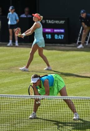 24th June 2023; Edgbaston Priory Club, Birmingham, England: Rothesay Classic Birmingham, Day 6; Womens doubles semi-final; Jelena Ostapenko (LAT) at the net waiting for Lyudmyla Kichenok (UKR) to serve to Storm Hunter (AUS) and Alycia Parks (USA)  ActionPlus12523510 GodfreyxPitt
