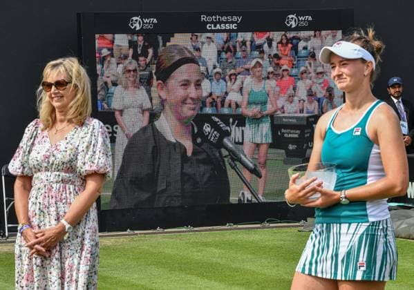 25th June 2023; Edgbaston Priory Club, Birmingham, England: Rothesay Classic Birmingham, Day 7; Singles Final; Barbora Krejcikova (CZE) watches as Jelena Ostapenko (LAT) speaks to Mark Curry after the match  ActionPlus12523728 GodfreyxPitt