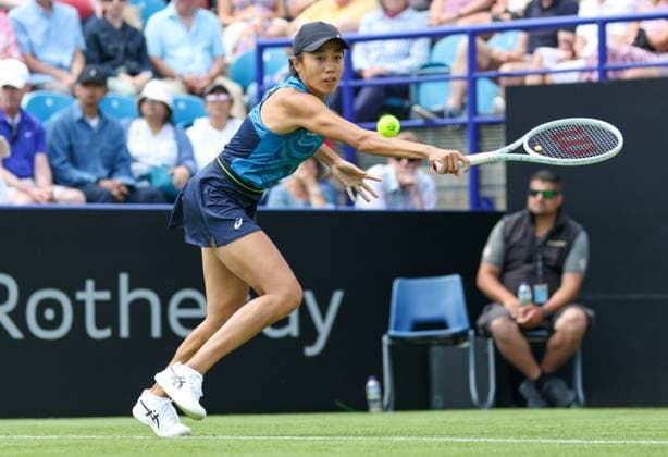 26th June 2023; Devonshire Park, Eastbourne, East Sussex, England: Rothesay International Eastbourne, Day 1, Shuai Zhang (CHN) plays a backhand against Harriet Dart (GBR)  ActionPlus12524312 HongboxChen