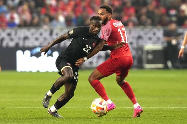 June 27, 2023, TORONTO, ON, CAN: Canada s Ritchie Laryea (right) skips past Guadeloupe s Anthony Baron during second half CONCACAF Gold Cup group stage action in Toronto, on Tuesday, June 27, 2023. Ritchie Laryea; Anthony Baron  - ZUMAc35_ 20230627_zaf_c35_129 Copyright: xChrisxYoungx