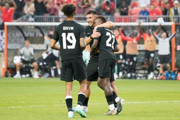 June 27, 2023, Toronto, Ontario, Canada: Richie Laryea 22 (R) celebrates with teamamtes after scoring a goal for Canada during the CONCACAF Gold Cup, Group Stage game between Canada and Guadeloupe at BMO field in Toronto. The game ended 2-2. Toronto Canada - ZUMAm154 20230627_zap_m154_026 Copyright: xAngelxMarchinix