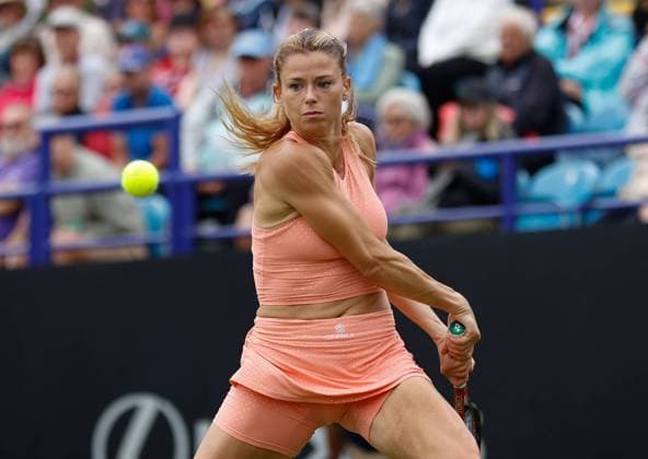 30th June 2023; Devonshire Park, Eastbourne, East Sussex, England: Rothesay International Eastbourne, Day 5, womens singles semi-final: Camila Giorgi (ITA) plays a backhand against Daria Kasatkina  ActionPlus12525262 HongboxChen