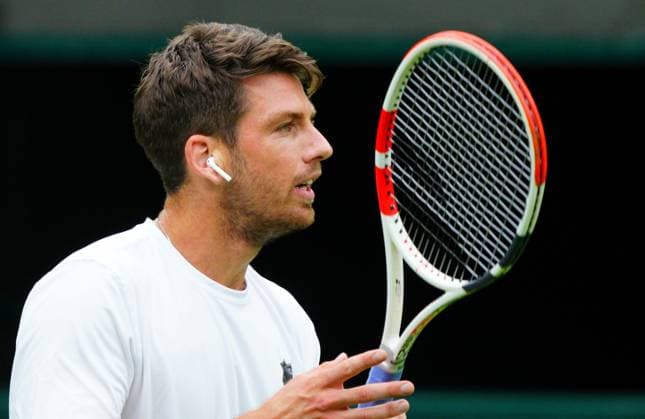Mandatory Credit: Photo by Javier Garcia Shutterstock (13987396v) Cameron Norrie practices wearing an earbud for the Wimbledon official film Wimbledon Tennis Championship Practice and Previews, The All England Lawn Tennis and Croquet Club, London, UK - 30 Jun 2023 Wimbledon Tennis Championship Practice and Previews, The All England Lawn Tennis and Croquet Club, London, UK - 30 Jun 2023  Copyright: xJavierxGarcia Shutterstockx 13987396v