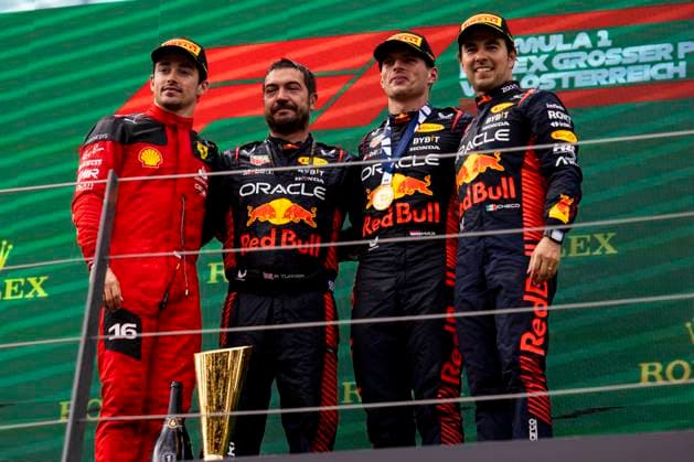 FORMULA 1 - GP of Austria 2023 SPIELBERG,AUSTRIA,02.JUL.23 - MOTORSPORTS, FORMULA 1 - Grand Prix of Austria, Red Bull Ring, podium. Image shows Charles Leclerc (MON Ferrari), a Red Bull mechanic, Max Verstappen (NED Red Bull Racing) and Sergio Perez (MEX Red Bull Racing).  GEPAxpictures xMatthiasxTrinkl