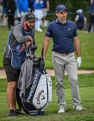 2nd July 2023; The Belfry, Sutton Coldfield, West Midlands, England: Betfred British Masters Golf, Day 4; Oliver Wilson discusses playing out of the bunker on the 17th hole with his caddy  ActionPlus12526625 GodfreyxPitt