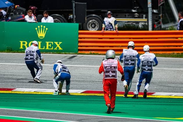 Marshalls picking up debris during the 2023 Formula 1 Rolex Grosser Preis von Osterreich, 2023 Austrian Grand Prix, 9th round of the 2023 Formula One World Championship, WM, Weltmeisterschaft from June 30 to July 2, 2023 on the Red Bull Ring, in Spielberg, Austria - F1 - AUSTRIAN GRAND PRIX 2023 - RACE DPPI Panoramic  00123023_G0OD5365 