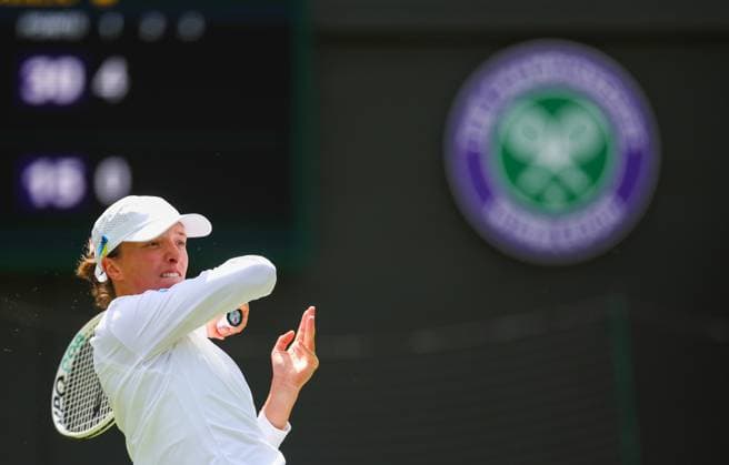 Mandatory Credit: Photo by Ella Ling Shutterstock (13992814j) Iga Swiatek in first round action Wimbledon Tennis Championships, Day 1, The All England Lawn Tennis and Croquet Club, London, UK - 03 Jul 2023 Wimbledon Tennis Championships, Day 1, The All England Lawn Tennis and Croquet Club, London, UK - 03 Jul 2023  Copyright: xEllaxLing Shutterstockx 13992814j