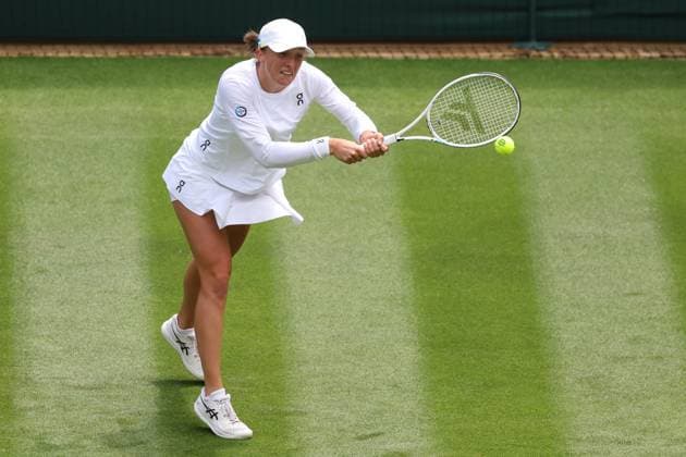 3rd July 2023; All England Lawn Tennis and Croquet Club, London, England: Wimbledon Tennis Tournament; Iga Swiatek plays a backhand shot to Lin Zhu in her womens singles match  ActionPlus12526772 ShaunxBrooks