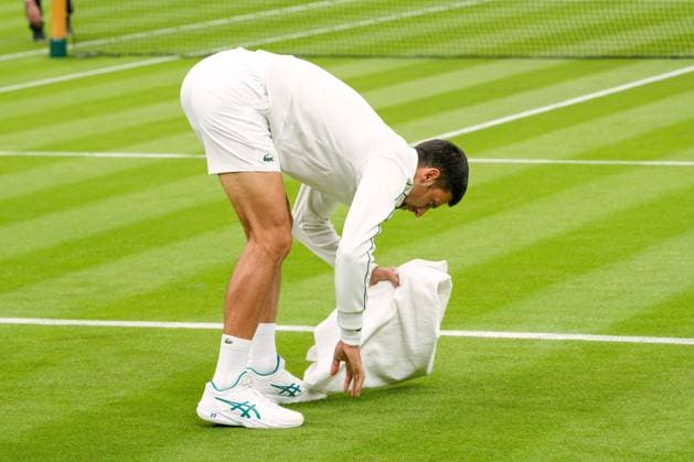 Mandatory Credit: Photo by Dave Shopland Shutterstock (13992815au) Novak Djokovic towel drying the court during his first round match Wimbledon Tennis Championships, Day 1, The All England Lawn Tennis and Croquet Club, London, UK - 03 Jul 2023 Wimbledon Tennis Championships, Day 1, The All England Lawn Tennis and Croquet Club, London, UK - 03 Jul 2023  Copyright: xDavexShopland Shutterstockx 13992815au
