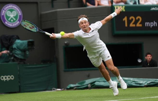 Sport Bilder des Tages Norway s Casper Ruud plays a forehand in his first round match against France s Laurent Lokoli on day one of the 2023 Wimbledon championships in London on Monday, July 03, 2023.  LON2023070328 HUGOxPHILPOTT