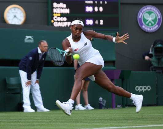 America s Coco Gauff plays a forehand during her first round match against America s Sofia Kenin on day one of the 2023 Wimbledon championships in London on Monday, July 03, 2023.  LON2023070366 HUGOxPHILPOTT
