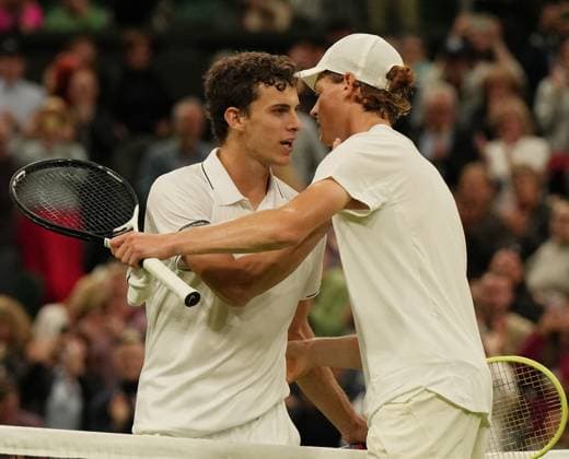 Tennis - 2023 Wimbledon Championships - Week One - Day One - All England Lawn Tennis & Croquet Club, Wimbledon - Monday 3rd July 2023 Yannick Sinner (ITA) v Juan Manuel Cerundolo (ARG) Yannick Sinner (ITA) at the net after winning the match 