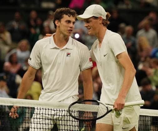 Tennis - 2023 Wimbledon Championships - Week One - Day One - All England Lawn Tennis & Croquet Club, Wimbledon - Monday 3rd July 2023 Yannick Sinner (ITA) v Juan Manuel Cerundolo (ARG) Yannick Sinner (ITA) at the net after winning the match 