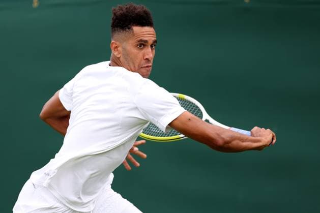 3rd July 2023; All England Lawn Tennis and Croquet Club, London, England: Wimbledon Tennis Tournament; Michael Mmoh plays a backhand shot to Felix Auger-Aliassime  ActionPlus12526888 ShaunxBrooks