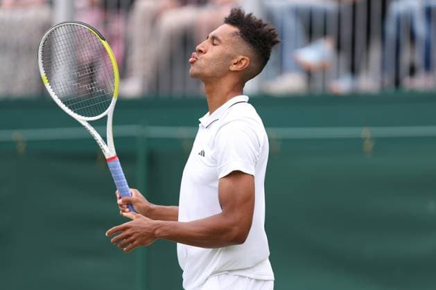 3rd July 2023; All England Lawn Tennis and Croquet Club, London, England: Wimbledon Tennis Tournament; Michael Mmoh reacts after he shot goes out during his match with Felix Auger-Aliassime  ActionPlus12526891 ShaunxBrooks