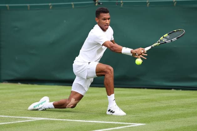 3rd July 2023; All England Lawn Tennis and Croquet Club, London, England: Wimbledon Tennis Tournament; Felix Auger-Aliassime plays a backhand shot to Michael Mmoh  ActionPlus12526897 ShaunxBrooks