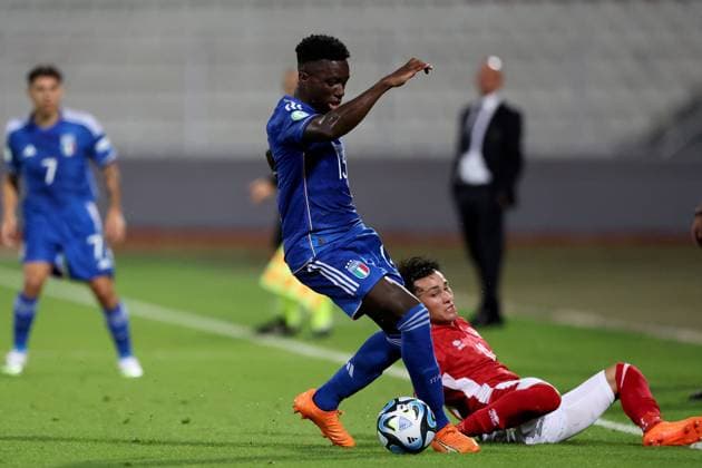 TA™QALI, MALTA JULY 3: Italy Under-19 soccer player Michael Kayode (front) gains control of the ball during the UEFA European Under-19 Championship 2022 23 Group A match between Malta and Italy at National Stadium on July 3, 2023, in Ta™Qali, Malta. UEFA European Under-19 Championship 2022 23 Final Tournament in Malta UEFA_U19_2023