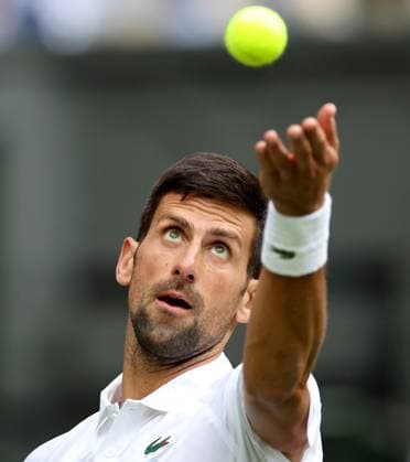 (230704) -- LONDON, July 4, 2023 -- Novak Djokovic of Serbia serves during the men s singles 1st round match against Pedro Cachin of Argentina at Wimbledon Tennis Championship in London, Britain, on July 3, 2023. ) (SP)BRITAIN-LONDON-TENNIS-WIMBLEDON-DAY 1 LixYing 