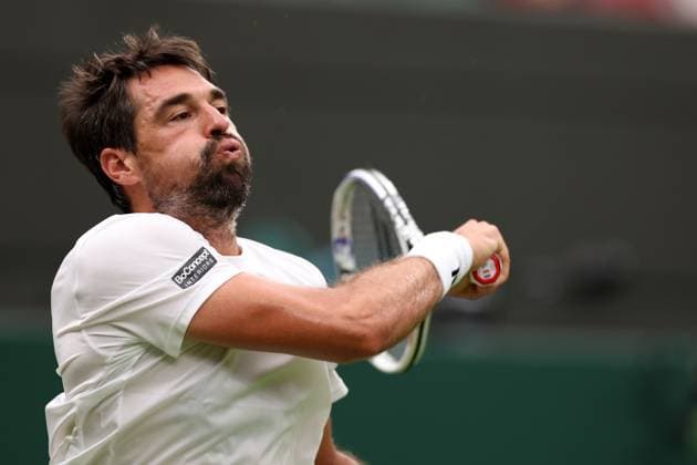 4th July 2023; All England Lawn Tennis and Croquet Club, London, England: Wimbledon Tennis Tournament; Jeremy Chardy plays a forehand shot to Carlos Alcaraz  ActionPlus12527017 ShaunxBrooks