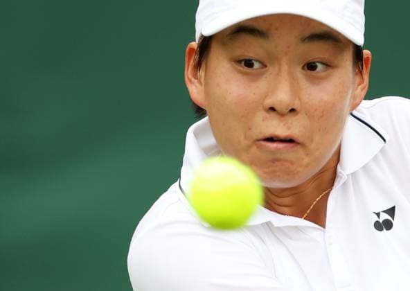 (230704) -- LONDON, July 4, 2023 -- Bai Zhuoxuan hits a return during the women s singles first round match between Bai Zhuoxuan of China and Ysaline Bonaventure of Belgium at Wimbledon Tennis Championships in London, Britain, July 4, 2023. ) (SP)BRITAIN-LONDON-TENNIS-WIMBLEDON-DAY 2 LixYing 