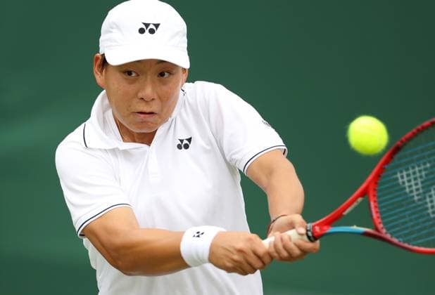 (230704) -- LONDON, July 4, 2023 -- Bai Zhuoxuan hits a return during the women s singles first round match between Bai Zhuoxuan of China and Ysaline Bonaventure of Belgium at Wimbledon Tennis Championships in London, Britain, July 4, 2023. ) (SP)BRITAIN-LONDON-TENNIS-WIMBLEDON-DAY 2 LixYing 