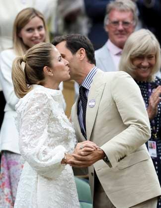 (230704) -- LONDON, July 4, 2023 -- Roger Federer (front R) kisses his wife Mirka Federer (front L) at Centre Court ahead of play on Day 2 of Wimbledon Tennis Championships in London, Britain, July 4, 2023. ) (SP)BRITAIN-LONDON-TENNIS-WIMBLEDON-ROGER FEDERER HanxYan 