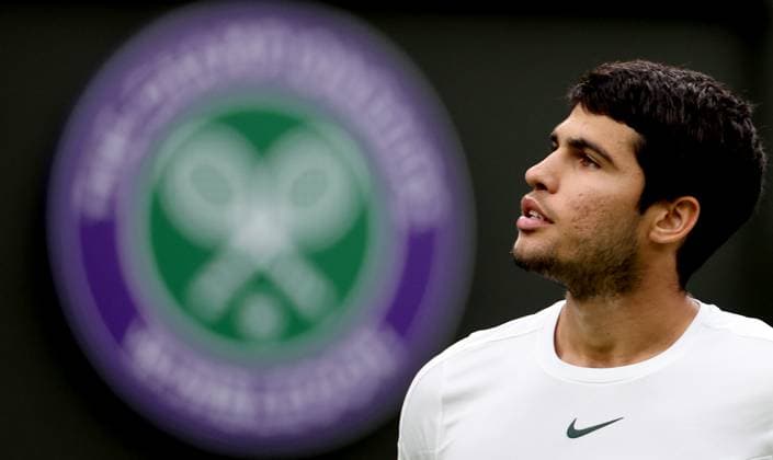 (230705) -- LONDON, July 5, 2023 -- Carlos Alcaraz of Spain reacts during the men s singles first round match against Jeremy Chardy of France at Wimbledon Tennis Championships in London, Britain, July 4, 2023. ) (SP)BRITAIN-LONDON-TENNIS-WIMBLEDON-DAY 2 LixYing 