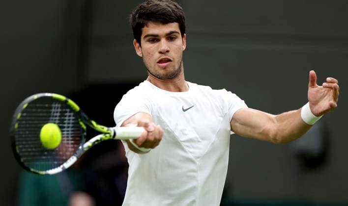 (230705) -- LONDON, July 5, 2023 -- Carlos Alcaraz of Spain returns a shot during the men s singles first round match against Jeremy Chardy of France at Wimbledon Tennis Championships in London, Britain, July 4, 2023. ) (SP)BRITAIN-LONDON-TENNIS-WIMBLEDON-DAY 2 LixYing 