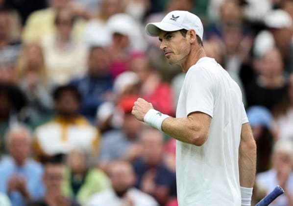 (230705) -- LONDON, July 5, 2023 -- Andy Murray of Britain reacts during the men s singles first round match against Ryan Peniston of Britain at Wimbledon tennis Championships in London, Britain, on July 4, 2023. ) (SP)BRITAIN-LONDON-TENNIS-WIMBLEDON-DAY 2 HanxYan 