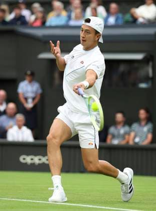 (230705) -- LONDON, July 5, 2023 -- Ryan Peniston of Britain returns a shot during the men s singles first round match against Andy Murray of Britain at Wimbledon tennis Championships in London, Britain, on July 4, 2023. ) (SP)BRITAIN-LONDON-TENNIS-WIMBLEDON-DAY 2 HanxYan 