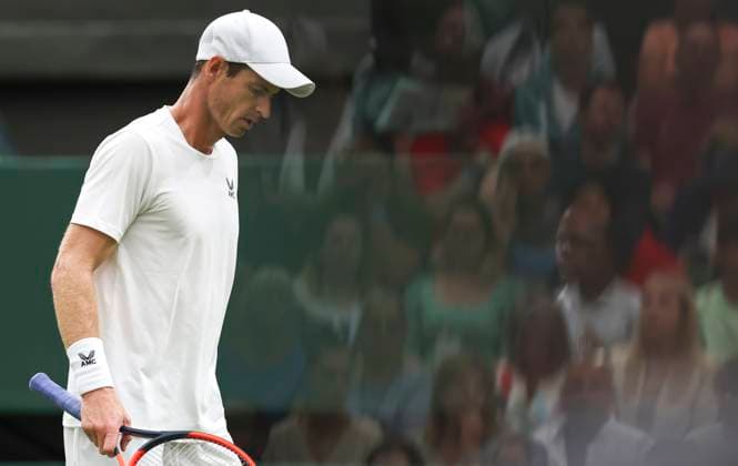 (230705) -- LONDON, July 5, 2023 -- Andy Murray of Britain reacts during the men s singles first round match against Ryan Peniston of Britain at Wimbledon tennis Championships in London, Britain, on July 4, 2023. ) (SP)BRITAIN-LONDON-TENNIS-WIMBLEDON-DAY 2 HanxYan 