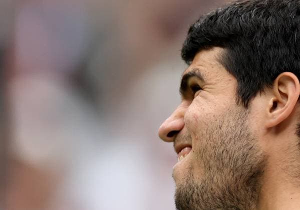 (230705) -- LONDON, July 5, 2023 -- Carlos Alcaraz of Spain reacts during the men s singles first round match against Jeremy Chardy of France at Wimbledon Tennis Championships in London, Britain, July 4, 2023. ) (SP)BRITAIN-LONDON-TENNIS-WIMBLEDON-DAY 2 LixYing 
