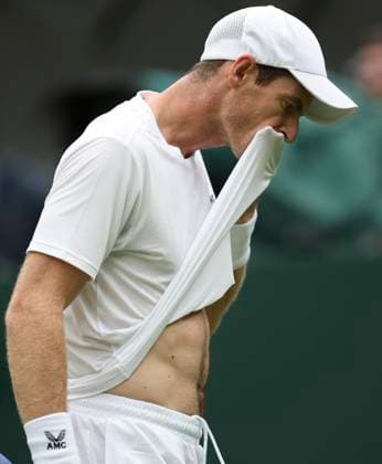 (230705) -- LONDON, July 5, 2023 -- Andy Murray of Britain wipes sweat during the men s singles first round match against Ryan Peniston of Britain at Wimbledon tennis Championships in London, Britain, on July 4, 2023. ) (SP)BRITAIN-LONDON-TENNIS-WIMBLEDON-DAY 2 HanxYan 