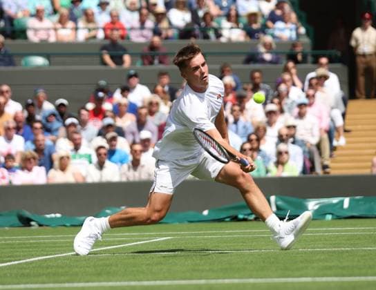 Britain s Arthur Fery plays a forehand in his first round match against Russia s Daniill Medvedev on day three of the 2023 Wimbledon championships in London on Wednesday, July 05, 2023.  LON2023070507 HUGOxPHILPOTT