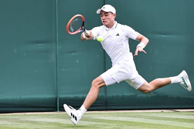 Wu Yibing, CHN, during rain delayed first round of 2023 All England Lawn Tennis Championships at Wimbledon, gentlemens singles, London, 05 07 2023