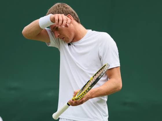 Belgian Kimmer Coppejans reacts during the second part of the match between Belgian Coppejans and Australian De Minaur, in the Men s Singles First Round, at the 2023 Wimbledon grand slam tennis tournament at the All England Tennis Club, in south-west London, Britain, . Due to the bad weather, play had to be suspended on Tuesday and Wednesday, and lots of matches had to be postponed. BENOITxDOPPAGNE  x70177982x