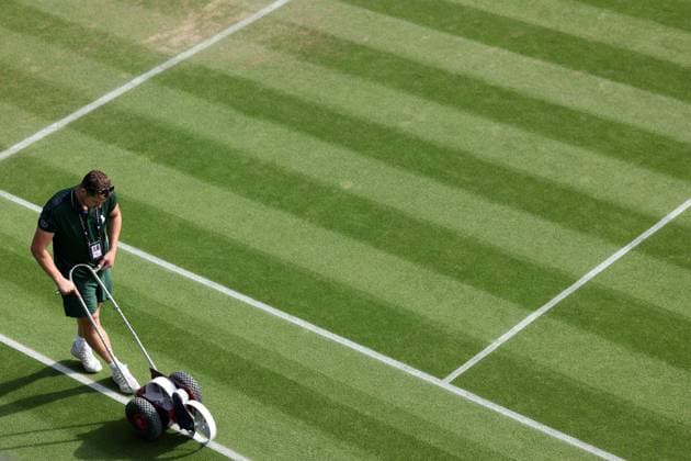 6th July 2023; All England Lawn Tennis and Croquet Club, London, England: Wimbledon Tennis Tournament; A Wimbledon groundsman paints the court lines  ActionPlus12527512 ShaunxBrooks